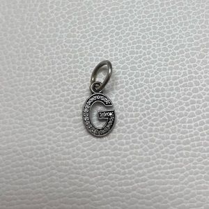 Retired letter G pandora charm.